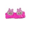 Vincha elástica de peluche fucsia con apliques de personajes animados