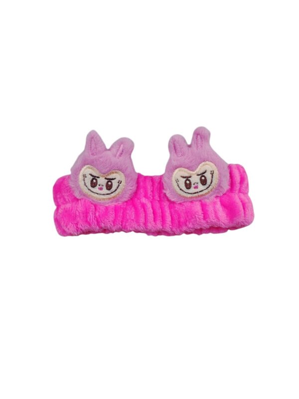Vincha elástica de peluche fucsia con apliques de personajes animados