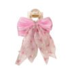 Broche para el pelo con moño rosa de organza con mariposas y perlas